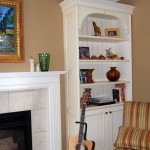 Custom Wall Units flanking an existing fireplace, add additional storage and display space to a Living Room Space.